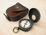 Late 19th century early verners style marching compass with leather case